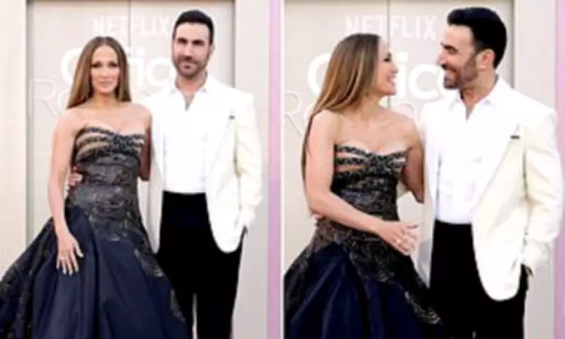 Jennifer Lopez and Brett Goldstein Sizzle at Office Romance Premiere