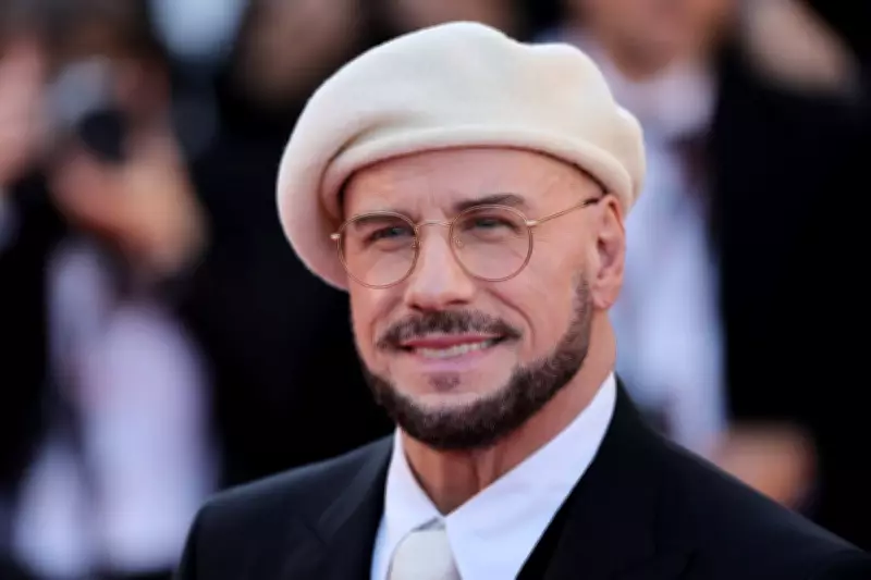 John Travolta Explains His New Beret Look at Cannes Film Festival