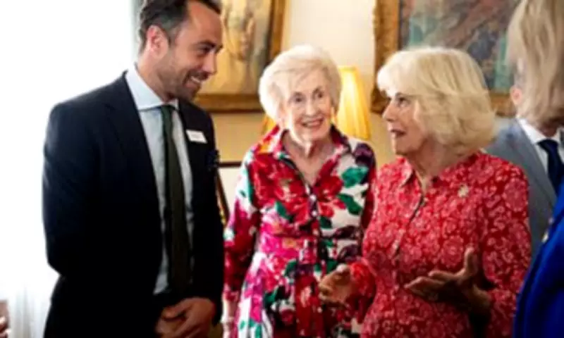 Queen Camilla and James Middleton Share Warm Embrace at Dog Charity Reception