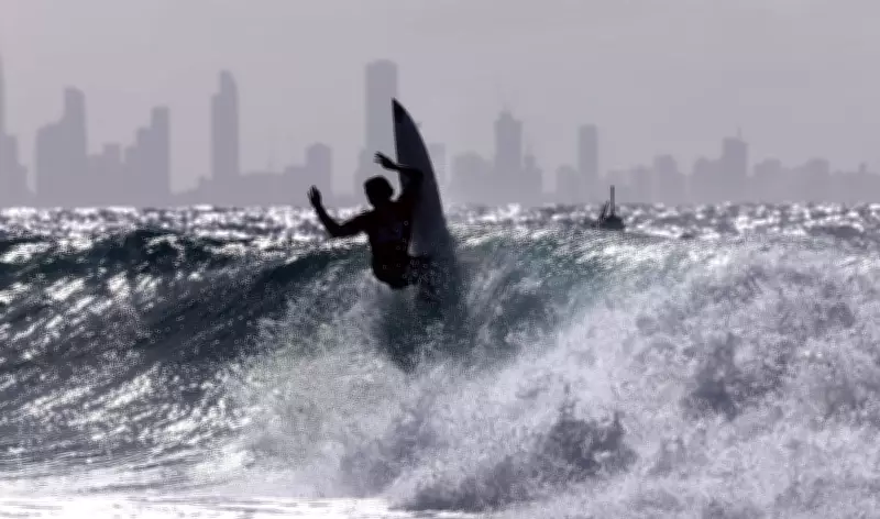 Surfing Contest and Cheese Race Highlight Monday's Photos