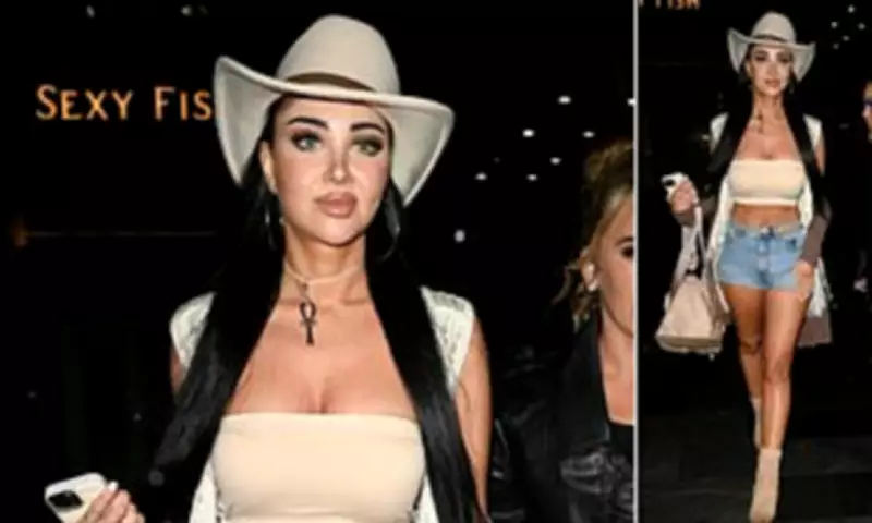 Tulisa Contostavlos Shows Off Toned Figure in Denim Shorts and Crop Top