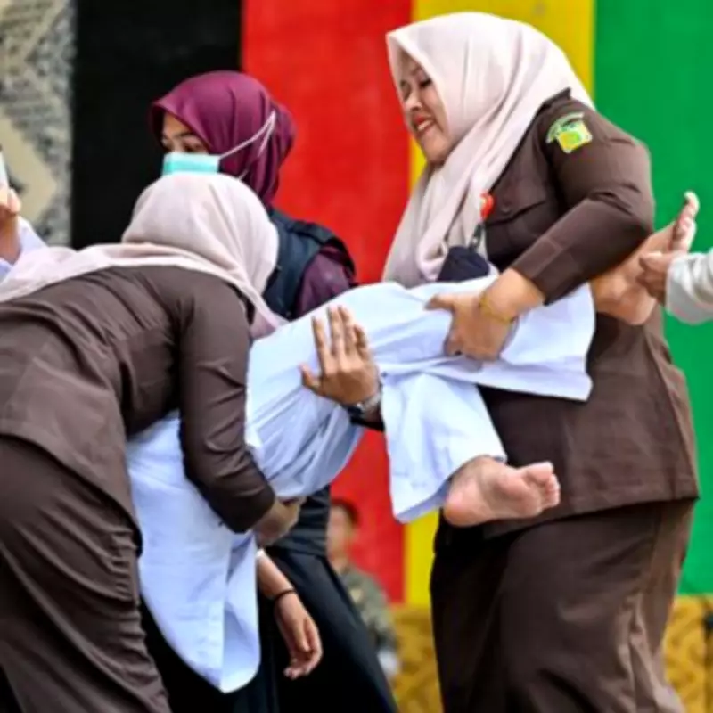 Woman Faints After 100 Lashes for Sex Outside Marriage in Indonesia