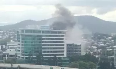 Brisbane Blaze: Person Rescued from Rooftop as Fire Engulfs Building