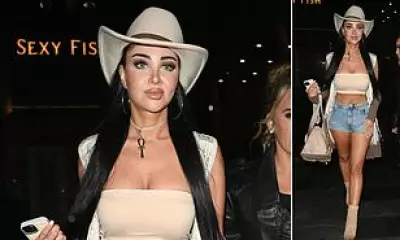 Tulisa Contostavlos Shows Off Toned Figure in Denim Shorts and Crop Top