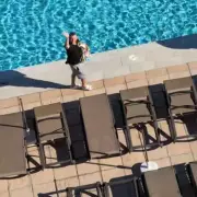 Family Cheers on Dad in Sunbed War as Tourists Push and Shout
