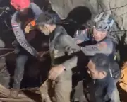First of seven men rescued from flooded Laos cave in perilous operation