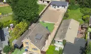 Homeowner Ordered to Demolish Oversized Outbuilding on Green Belt Land