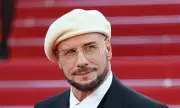 John Travolta's Bizarre Beret and Dyed Beard Stuns Fans at Cannes
