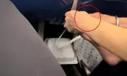Passenger horrified as woman picks dead skin off bare feet on flight