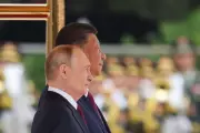 Putin in China, Arsenal Win Premier League: Wednesday's Top Stories
