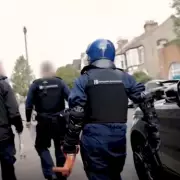 Woman Arrested for Coaching Asylum Seekers to Fake Being Gay