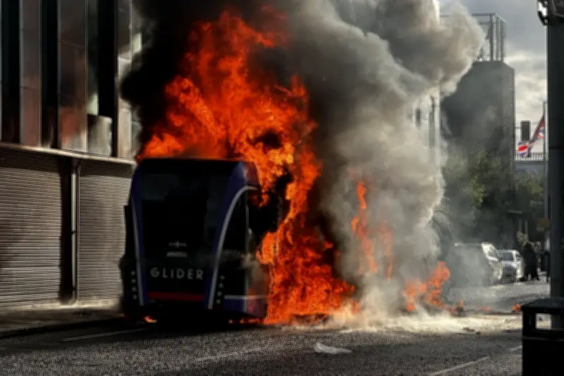 Belfast Bus Set Ablaze by Masked Protesters After Stabbing Attack