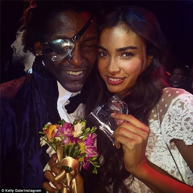 Victoria's Secret Model Kelly Gale Celebrates with Trainer After Show