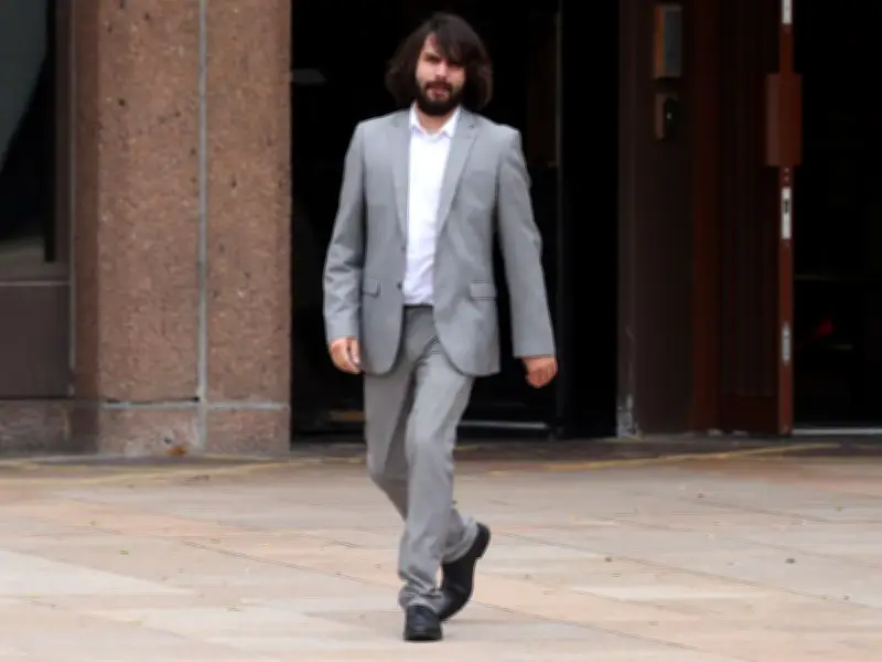 Burglar booted down woman's door, put in headlock by sons, spared jail