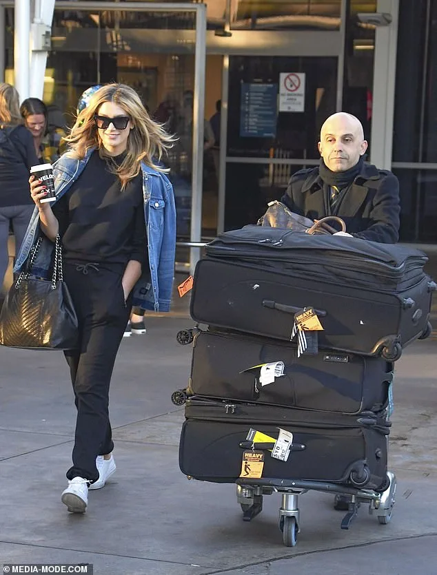 Delta Goodrem Lets Chauffeur Handle Luggage at Sydney Airport