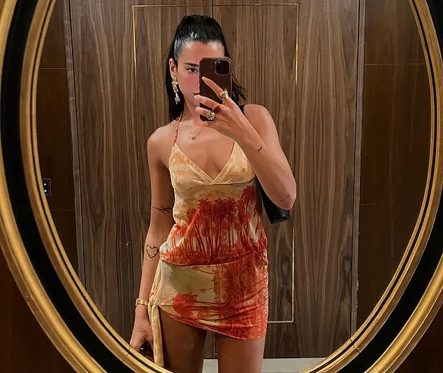 Dua Lipa Flashes Toned Physique in Silk Co-ord During Lisbon Night Out