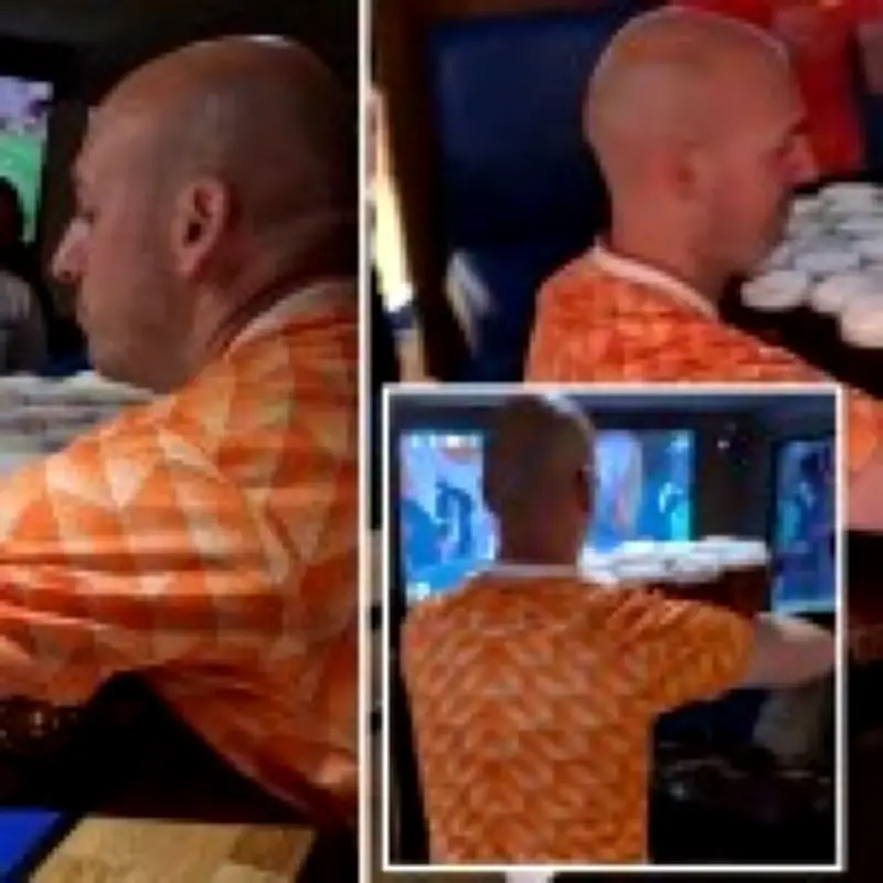 Dutch fan carries 26 pints of beer from bar to table in one go