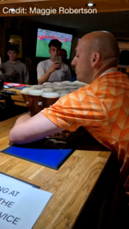 Dutch fan carries 26 pints of Tennent's in Fort William pub