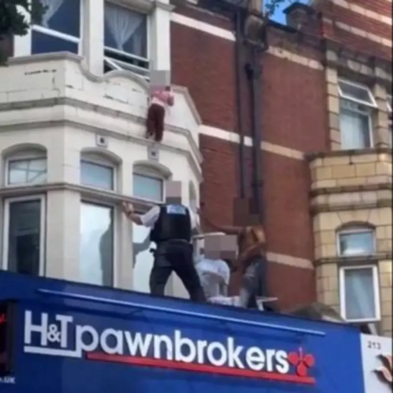 Hero catches toddler falling from ledge above East London street