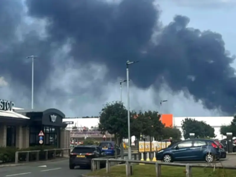 Huge fire at Cheshire warehouse sends black smoke into sky
