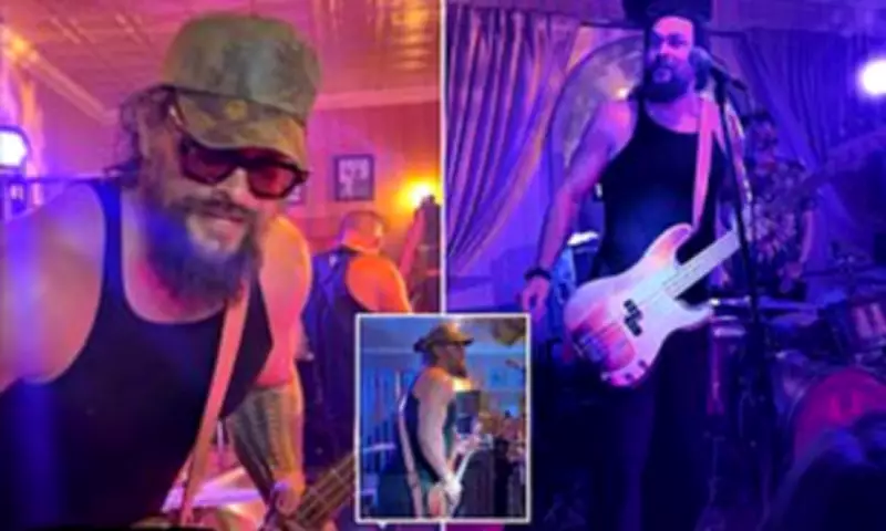 Jason Momoa Shows Off Buff Physique in Rock Band Performance