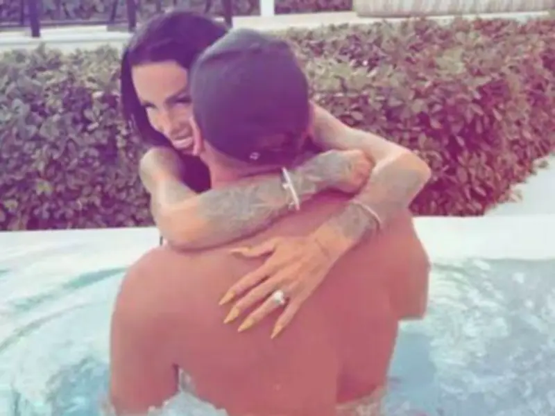 Katie Price and Lee Andrews Canoodle in Dubai Pool Amid Fraud Allegations
