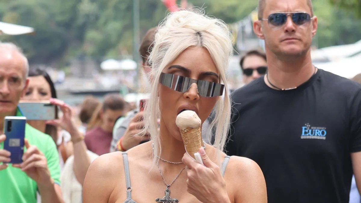 Kim Kardashian Turns Heads in Skintight Catsuit in Italy Ahead of Kourtney's Wedding