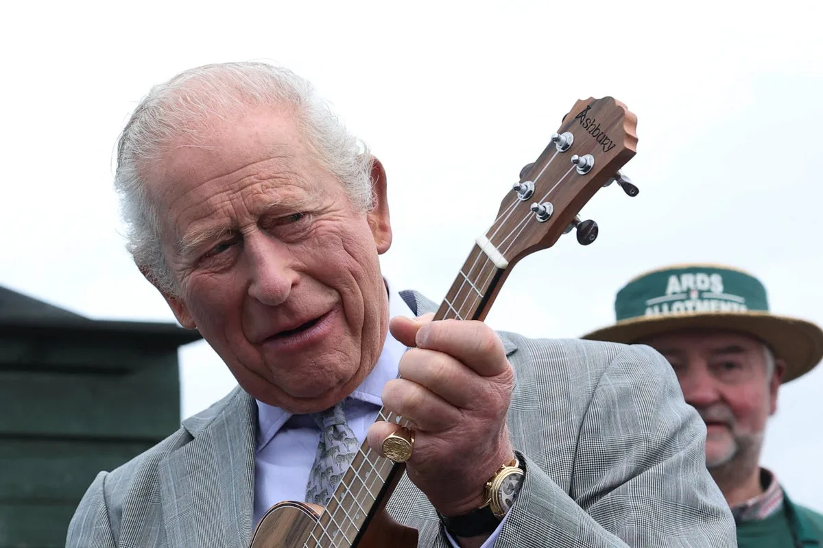 King Charles Strumming Ukulele At Co Down Allotment