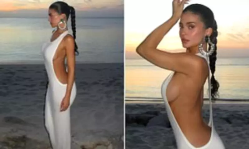 Kylie Jenner Flashes Major Sideboob in Racy White Maxi Dress on Vacation