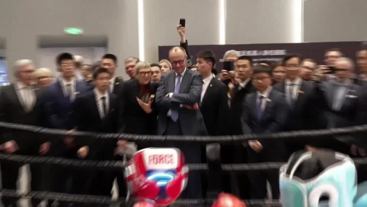 Merz Ends China Trip At Robot Boxing Match