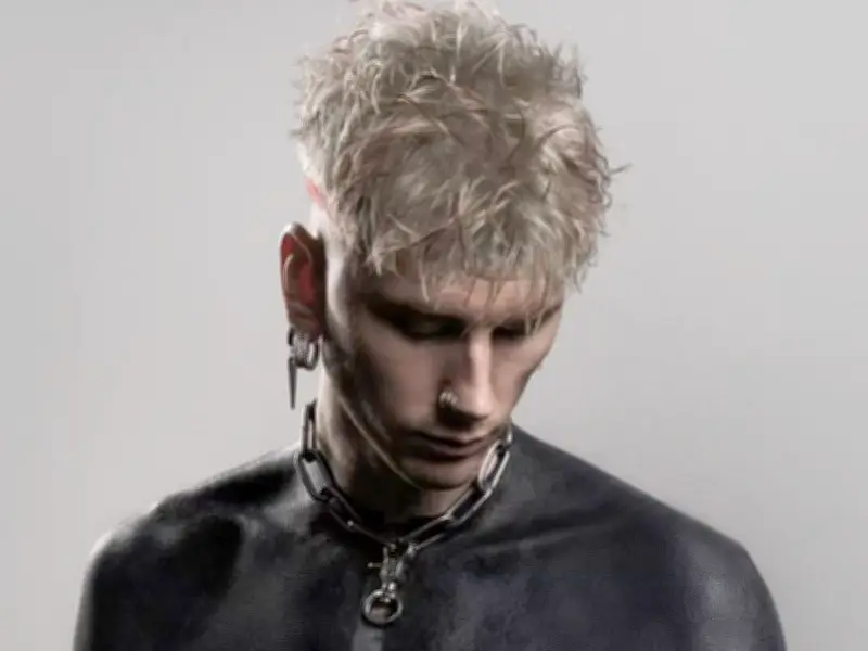 MGK Reveals Gruesome Side Effects of Blackout Body Tattoo