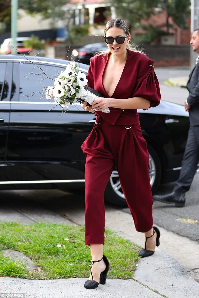 Jesinta Campbell Turns Heads in Plunging Maroon Jumpsuit in Sydney