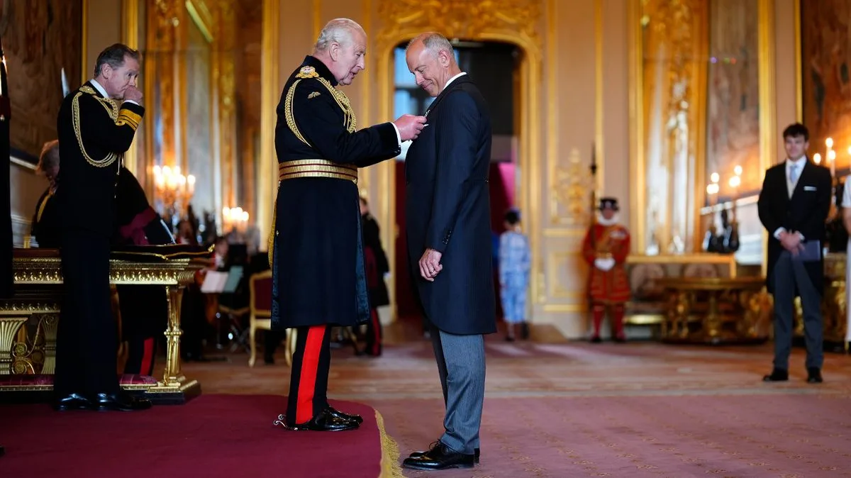 Phil Spencer Receives MBE from King Charles at Windsor Castle
