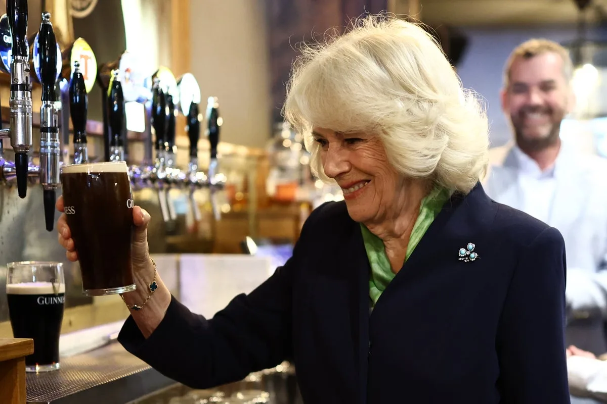 Queen Camilla Pours Perfect Pint of Guinness During Northern Ireland Visit