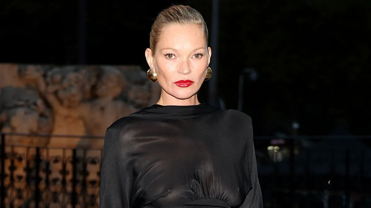 Kate Moss Commands Attention in Glam Black Mini for YSL's PFW Show