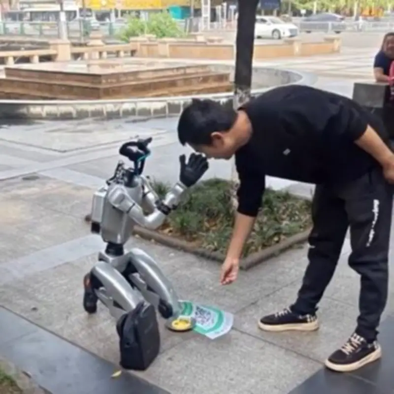 Robot Begs for Cash on Knees in China After Hitting Rock Bot-Tom