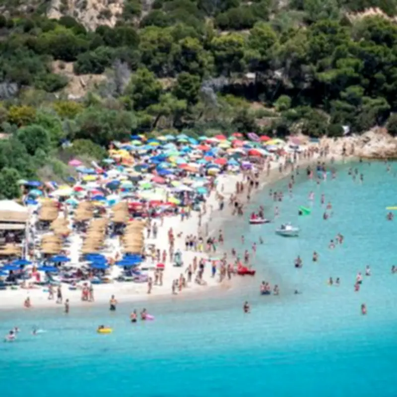 Sardinian Beach Bans Umbrellas for Most Sunbathers in 40C Heat