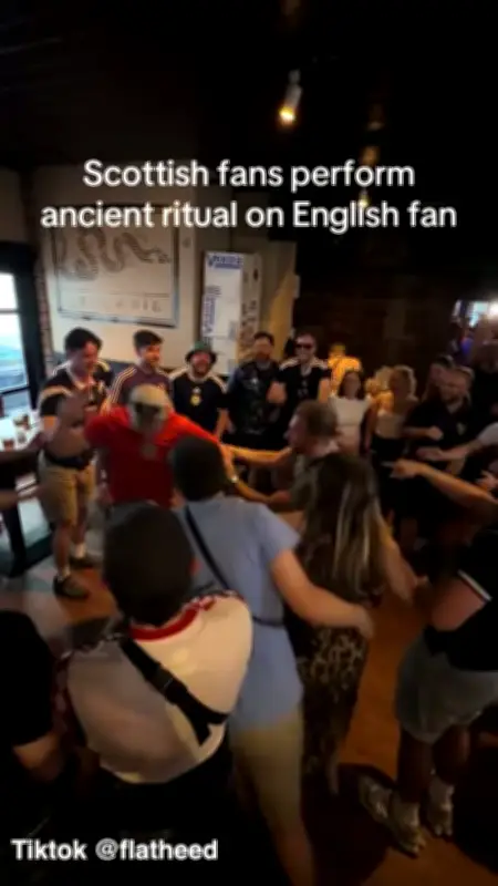 Scotland Fans Perform 'Ancient Ritual' on England Fan in Boston Pub