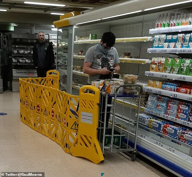 Tesco Staff Use Security Barriers to Shield Themselves from Shoppers Chasing Yellow Sticker Deals