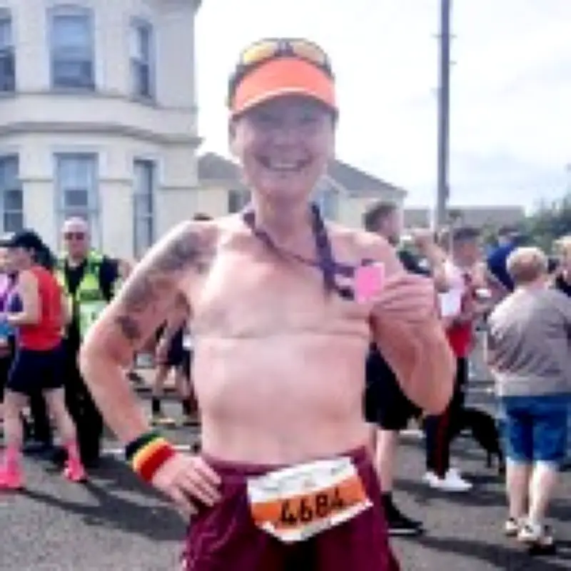 Topless Mum-of-Two Completes Ultramarathon to Raise Breast Cancer Awareness