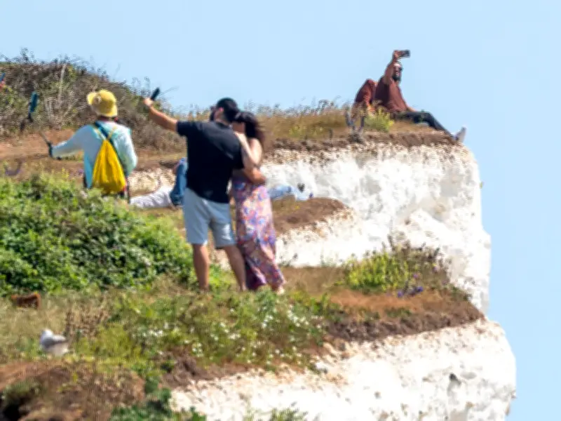 Tourists Risk Lives on Crumbling Cliffs at Birling Gap During Heatwave