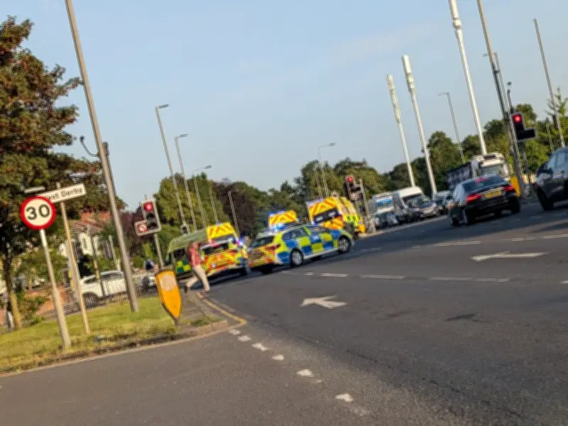 Two Injured in Ambulance and Car Crash on Queens Drive