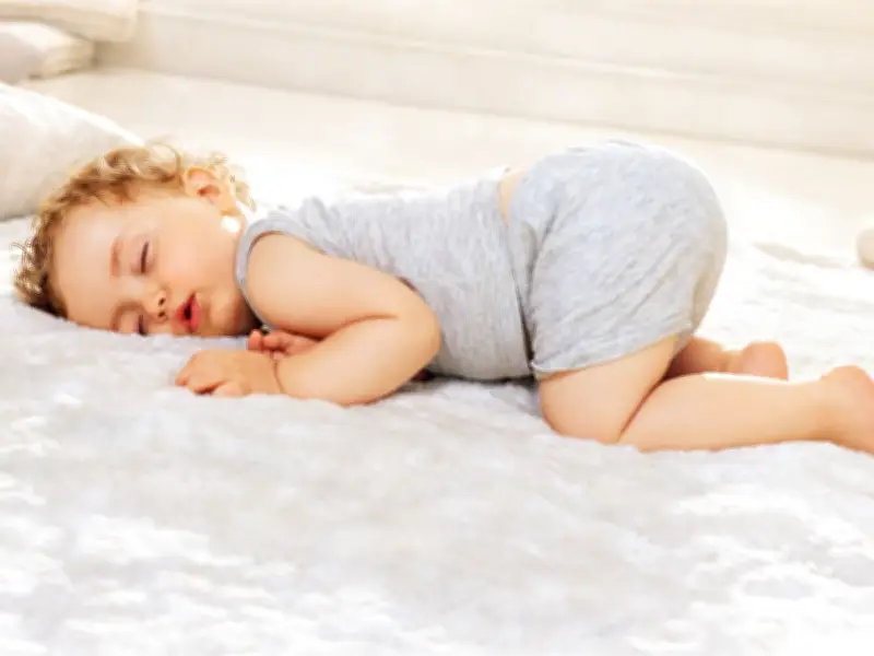 Why Do Babies Sleep with Their Bum in the Air? Experts Explain the Adorable Froggy Position