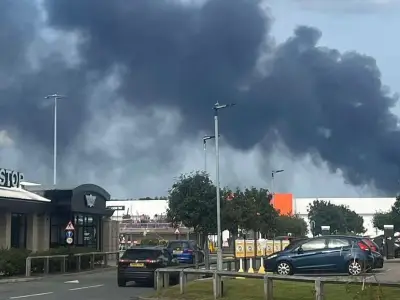 Huge fire at Cheshire warehouse sends black smoke into sky