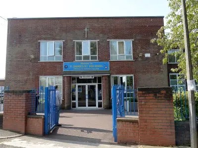 Woman arrested on child sex offences at Bury school