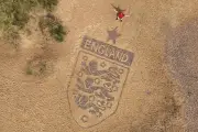 Artist Crafts Giant England Badge on Beach for World Cup