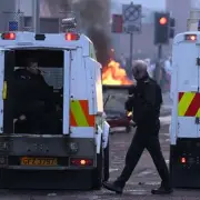 Belfast erupts: masked gangs torch streets after stabbing charge