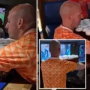 Dutch fan carries 26 pints of beer from bar to table in one go