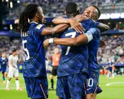 France overcome two-hour storm delay to beat Iraq 3-0 in World Cup