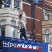 Hero catches toddler falling from ledge above East London street